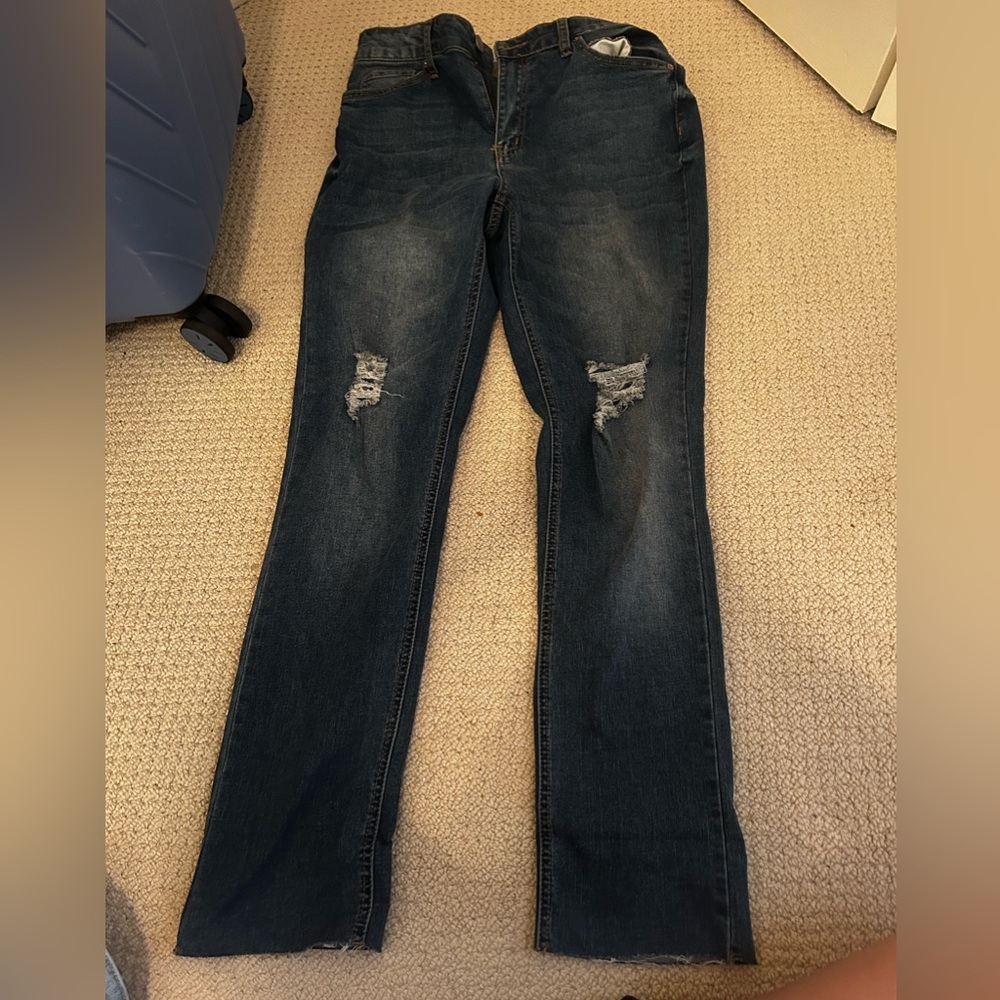 Dark Wash Size 10 Copper Flash jeans, slight rips at knees, skinny jean fit.